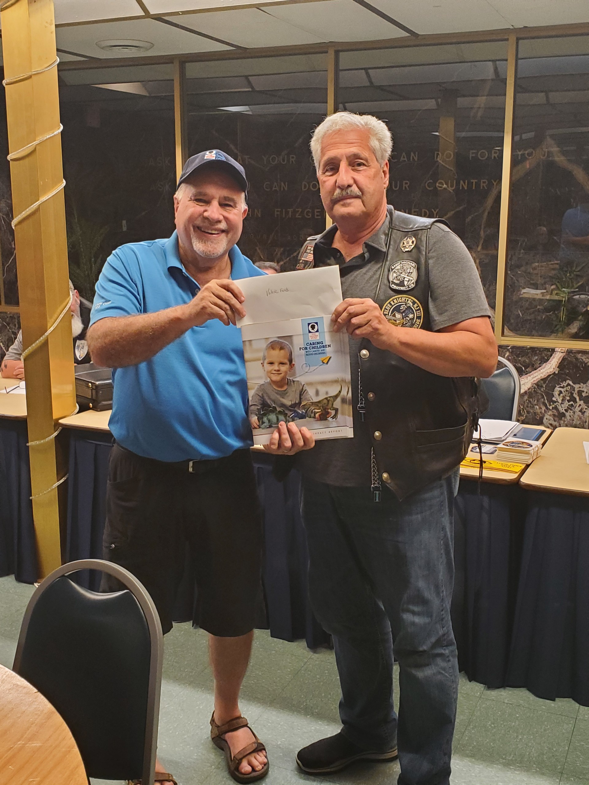 6/8/2021: Our President Jeff Joy presents a donation check to Barry Kirschner, Executive Director of the Valerie Fund (our primary charity) from the proceeds of our recent Cigar Night Charity Event.